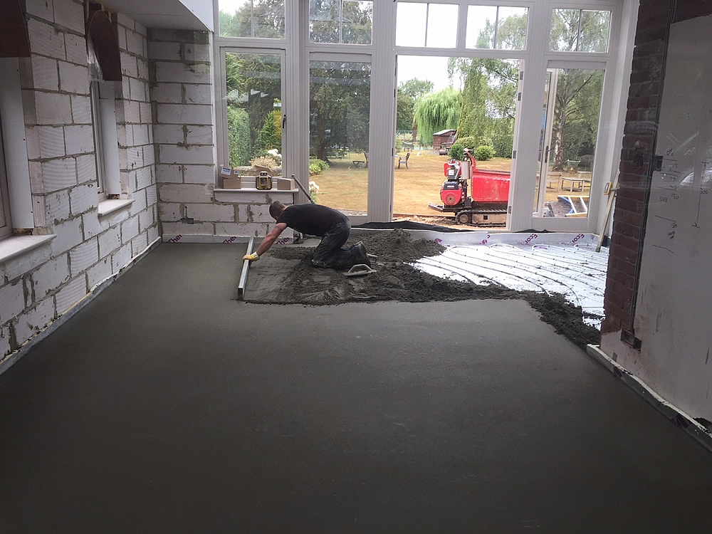 ORANGERY PROJECT STORY.  Screeding being installed over the orangery underfloor heating pipes