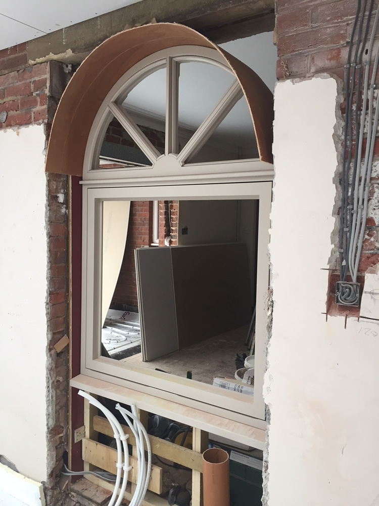 ORANGERY PROJECT STORY - Previous French doorway converted to arched internal window