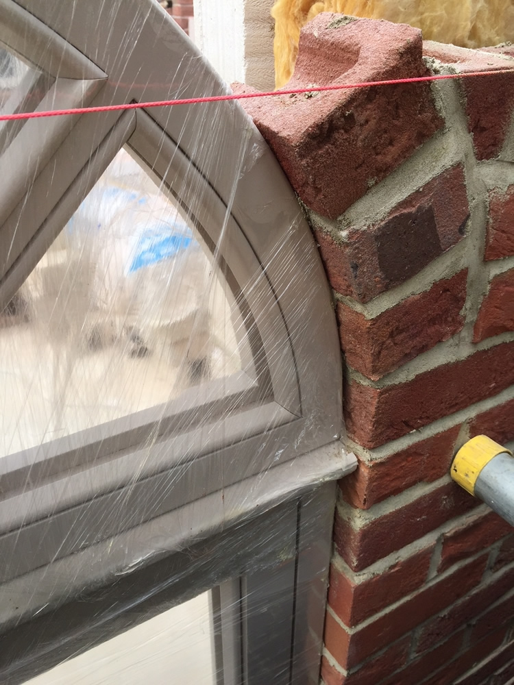 ORANGERY PROJECT STORY - Shaping the wall around the round topped orangery windows. Rounded windows add a touch of class to the look of the orangery