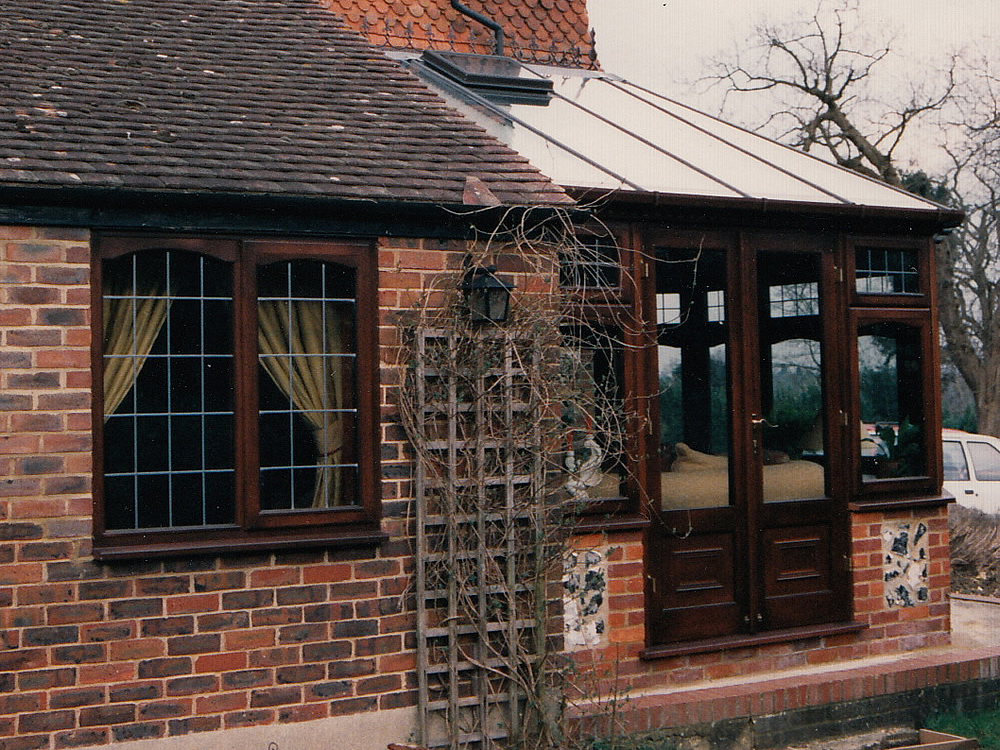 This hard wood conservatory blends in very well on this listed building